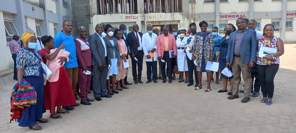 Members of Parliament's Health Committee with the SHU Executive Director during a field visit to CHF schemes in Luwero district.