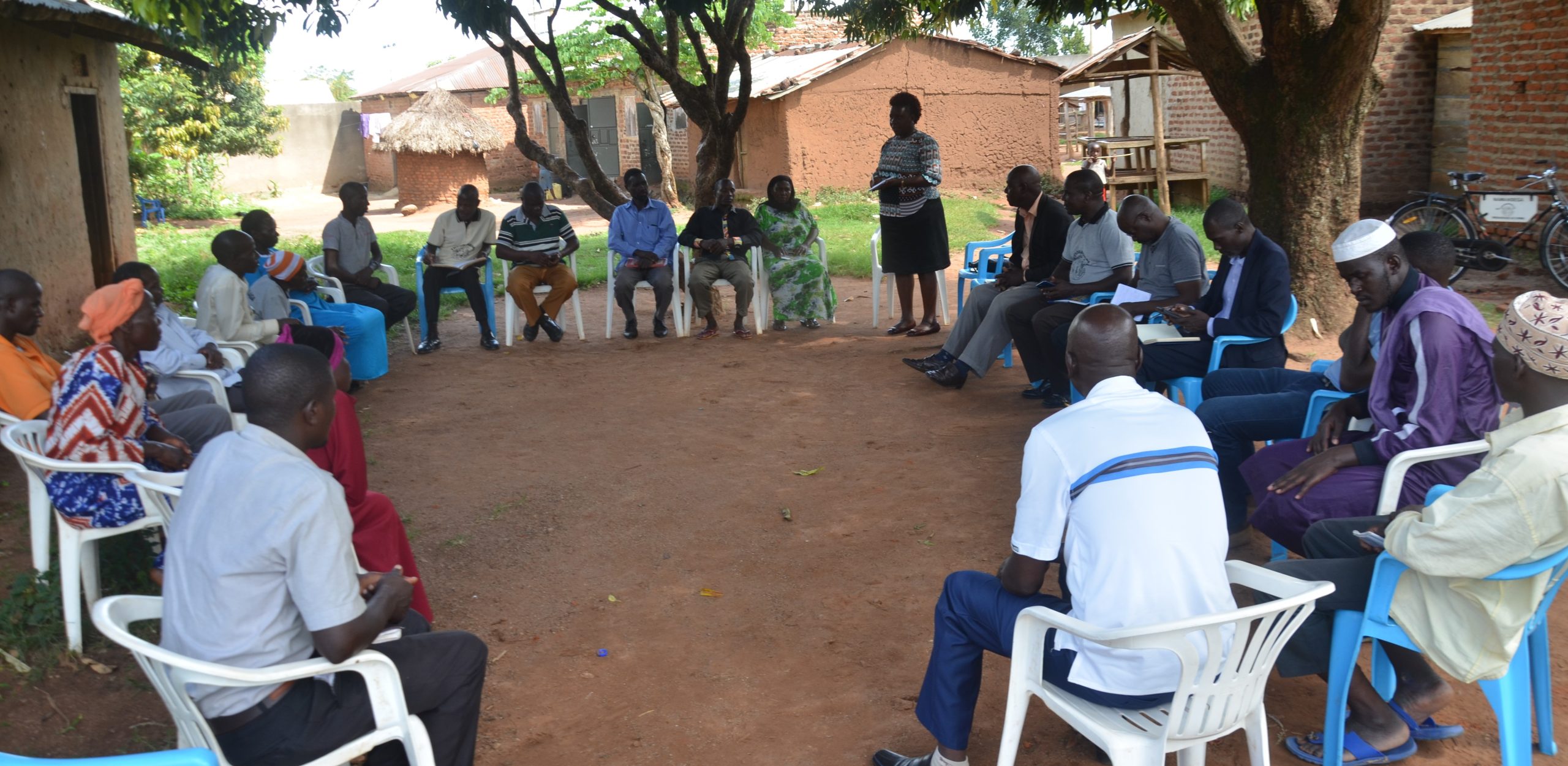 Ms. Leticia Nakimuli, Board Chair SHU, addressing CHI scheme members during community engagement meetings.